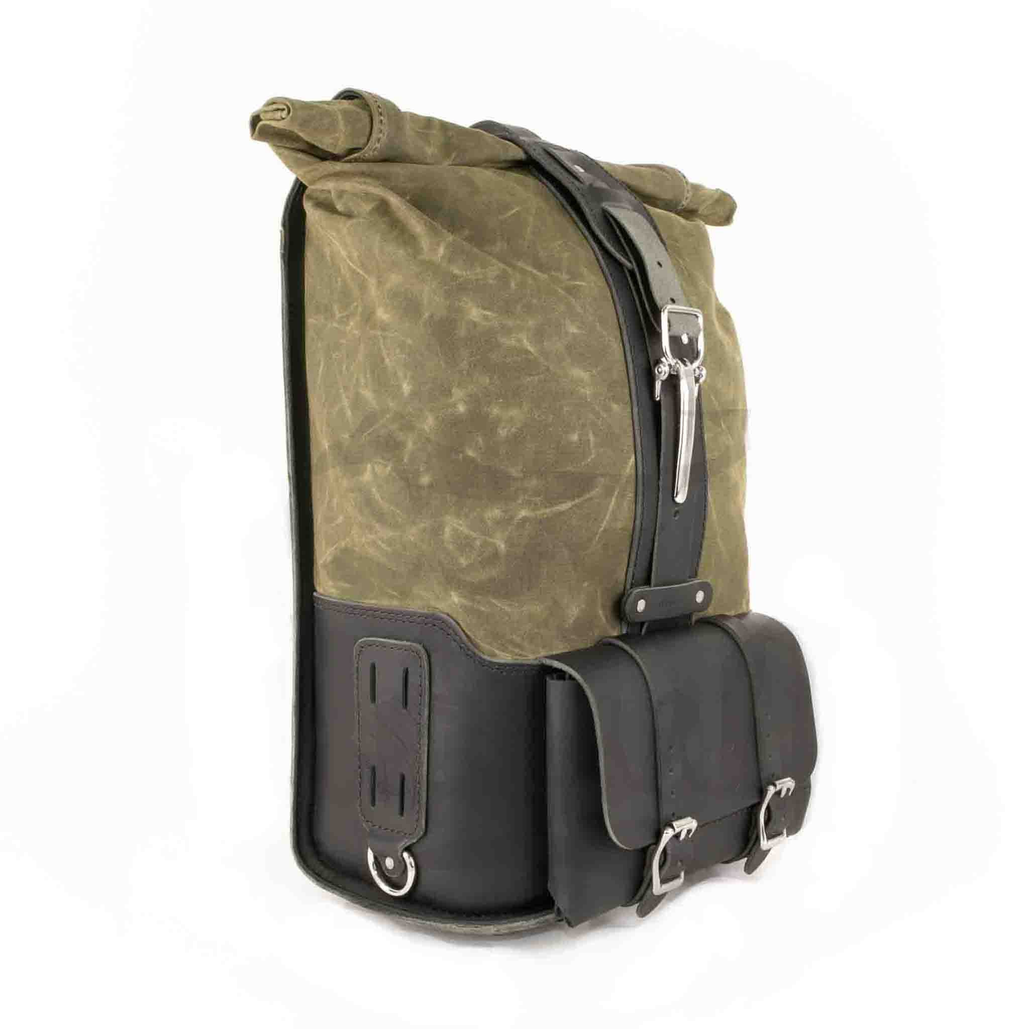 Upgrade your ride with the URB02 Rolltop Backpack Saddlebag. Unique design enables quick conversion from saddlebag to backpack. Hand crafted in USA with premium veg tan water buffalo leather, waxed canvas and stainless steel hardware. Durable and stylish, it's the perfect fit for your motorcycle.