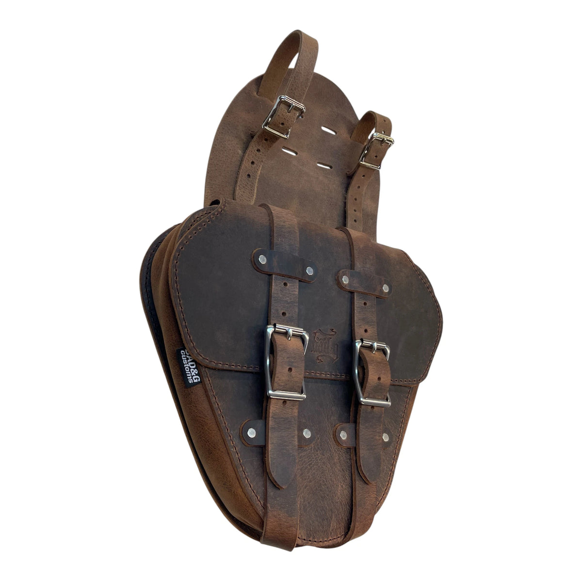 Brown leather saddlebags with metal buckles on a white background